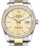 Datejust 36mm in Steel with Yellow Gold Diamond Bezel on Oyster Bracelet with Champagne Fluted Motif Dial