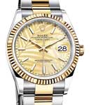 Datejust 36mm in Steel with Yellow Gold Fluted Bezel on Oyster Bracelet with Champagne Palm Motif Dial