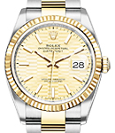 Datejust 36mm in Steel with Yellow Gold Fluted Bezel on Oyster Bracelet with Champagne Fluted Motif Dial