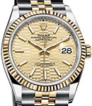 Datejust 36mm in Steel with Yellow Gold Fluted Bezel on Jubilee Bracelet with Champagne Fluted Motif Dial