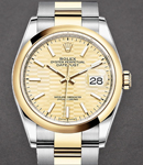 Datejust 36mm in Steel with Yellow Gold Smooth Bezel on Oyster Bracelet with Champagne Fluted Motif Dial