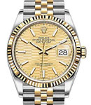 Datejust 36mm in Steel with Yellow Gold Fluted Bezel on Jubilee Bracelet with Champagne Fluted Motif Dial