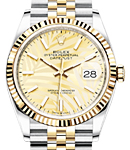 Datejust 36mm in Steel with Yellow Gold Fluted Bezel on Jubilee Bracelet with Champagne Palm Stick Dial