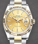 Datejust 36mm in Steel with Yellow Gold Fluted Bezel on Oyster Bracelet with Champagne Stick Dial