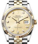 Datejust 36mm in Steel with Yellow Gold Fluted Bezel on Jubilee Bracelet with Champagne Fluted Motif Diamond Dial