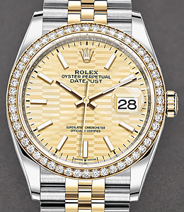 Datejust 36mm in Steel with Yellow Gold Diamond Bezel on Jubilee Bracelet with Champagne Fluted Motif Stick Dial