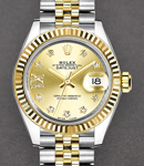 Datejust Ladies 28mm in Steel with Yellow Gold Fluted Bezel on Jubilee Bracelet with Champagne Star Diamond Dial