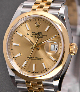 Datejust 36mm in Steel with Yellow Gold Smooth Bezel on Jubilee Bracelet with Champagne Stick Dial