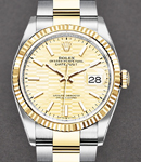 Datejust 36mm in Steel with Yellow Gold Fluted Bezel on Oyster Bracelet with Champagne Fluted Motif Dial