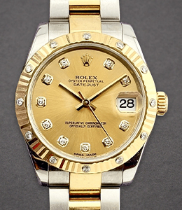 Datejust 31mm in Steel with Yellow Gold Fluted Diamond Bezel on Oyster Bracelet with Champagne Diamond Dial