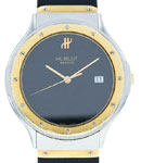 Classic 36mm in Steel with Yellow Gold Bezel on Black Rubber Strap with Black Dial