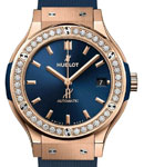 Classic Fusion 38mm in Rose Gold with Diamond Bezel on Blue Rubber Strap with Blue Dial