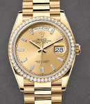 Day Date 36mm in Yellow Gold with Diamond Bezel on Bracelet with Champagne Baguette Diamond Dial