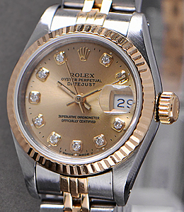 Datejust Ladies 26mm in Steel with Yellow Gold Fluted Bezel on Jubilee Bracelet with Champagne Diamond Dial
