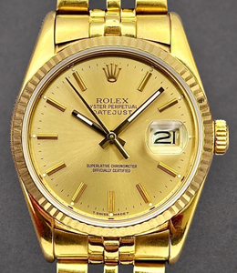 Datejust 36mm in Yellow Gold with Fluted Bezel on Jubilee Bracelet with Champagne Stick Dial