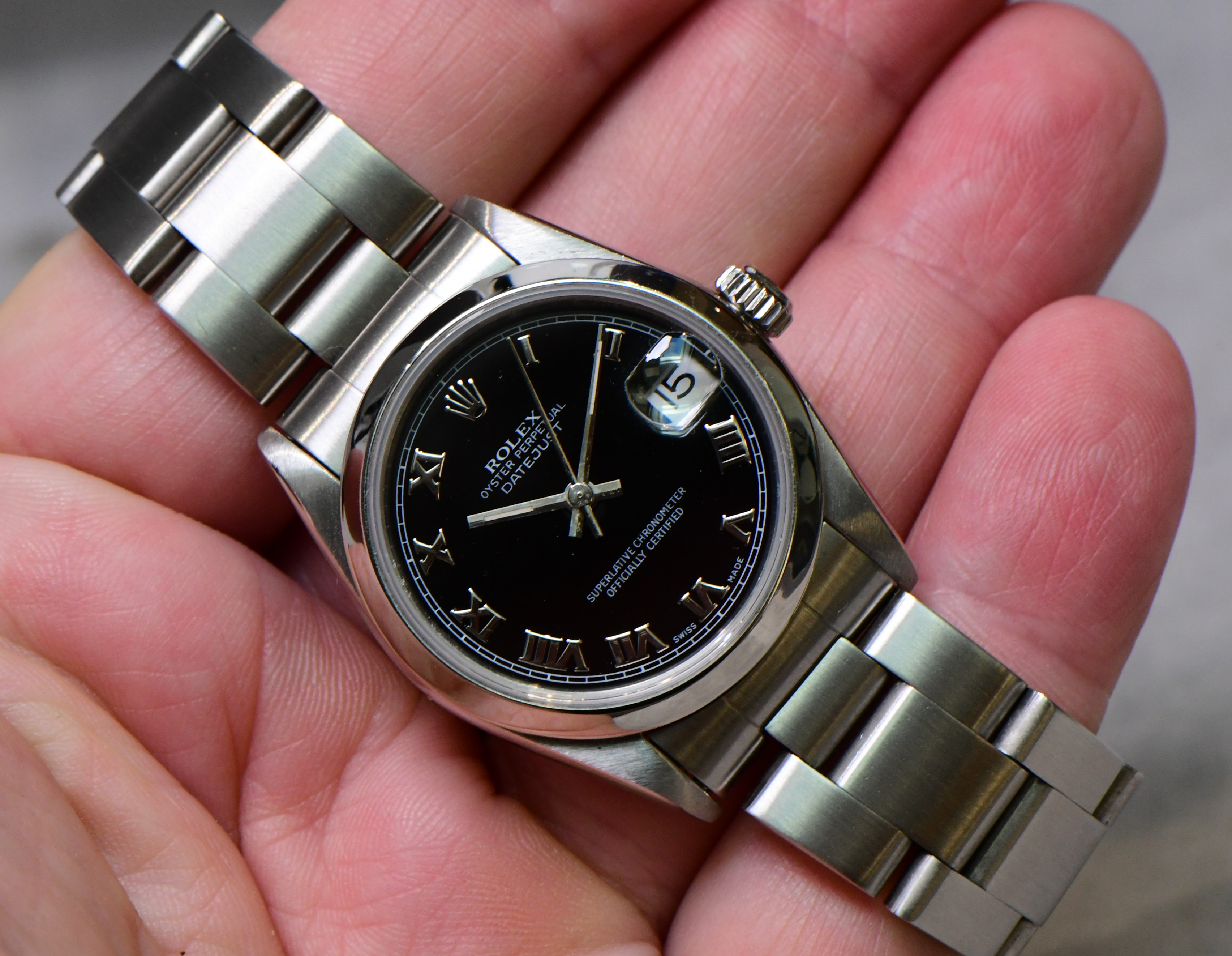 Pre-Owned Rolex Mid Size Datejust 31mm in Steel with Smooth Bezel on Steel Oyster Bracelet with Black Roman Dial
