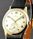 Vintage Oyster in Yellow Gold on Black Crocodile Leather Strap with Silver Dial