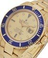 Submariner in Yellow Gold with Blue Bezel on Oyster Bracelet with Champagne Diamond Dial