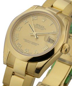 Datejust 31mm Mid Size in Yellow Gold with Domed Bezel on Yellow Gold Oyster Bracelet with Champagne Roman Dial
