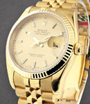 Datejust 36mm in Yellow Gold with Fluted Bezel on Jubilee Bracelet with Champagne Stick Dial