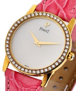 Classique Lady's Yellow Gold with Diamond Bezel MOP Guilloche Dial on Pink Strap