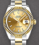 Datejust 31mm Midsize in Steel with Yellow Gold Fluted Bezel on Oyster Bracelet with Champagne Index Dial