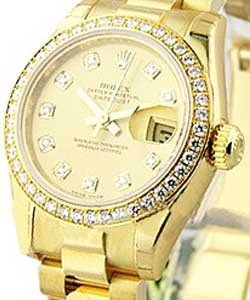 Datejust 26mm in Yellow Gold with Diamond Bezel on President Bracelet with Champagne Diamond Dial