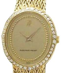 Lady's Diamond Dress in Yellow Gold with Diamonds Bezel on Yellow Gold with Champagne Dial