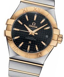 Constellation Co- Axial in Steel with Yellow Gold Bezel on Steel and Yellow Gold Bracelet with Black Dial