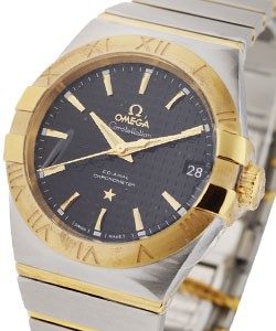 Constellation  in Steel with Yellow Gold Bezel on Steel and Yellow Gold Bracelet with Black Dial