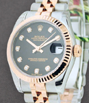 Ladies Datejust 26mm in Steel with Rose Gold Fluted Bezel on Jubilee Bracelet with Black Diamond Dial