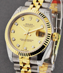 Datejust 31mm in Steel with Yellow Gold Fluted Bezel on Jubilee Bracelet with Champagne Diamond Dial