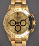 Daytona in Yellow Gold with Engraved Bezel on Oyster Bracelet with Champagne Diamond Dial