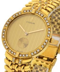 Classical in Yellow Gold with Diamonds on Bezel  on Yellow Gold Diamond Bracelet with Champagne Dial