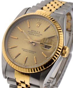 Datejust 36mm in Steel with Yellow Gold Fluted Bezel on Jubilee Bracelet with Champagne Tapeistry Stick Dial