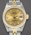 Datejust Ladies 26mm in Steel with Yellow Gold Fluted Bezel on Jubilee Bracelet with Champagne Diamond Dial