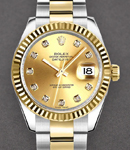 Datejust 31mm in Steel with Yellow Gold Fluted Bezel on Oyster Bracelet with Champagne Diamond Dial
