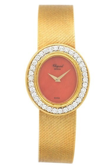 Circa 1970s in Yellow Gold with Diamond Bezel on Yellow Gold Bracelet with Orange Coral Dial