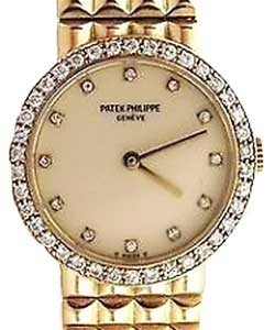 Ladies in Yellow Gold with Diamond and Sapphire Bezel on Yellow Gold Bracelet with Ivory and Diamond Dial