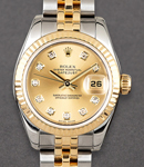 Datejust Lady's 26mm in Steel with Yellow Gold Fluted Bezel on Jubilee Bracelet with Champagne Diamond Dial