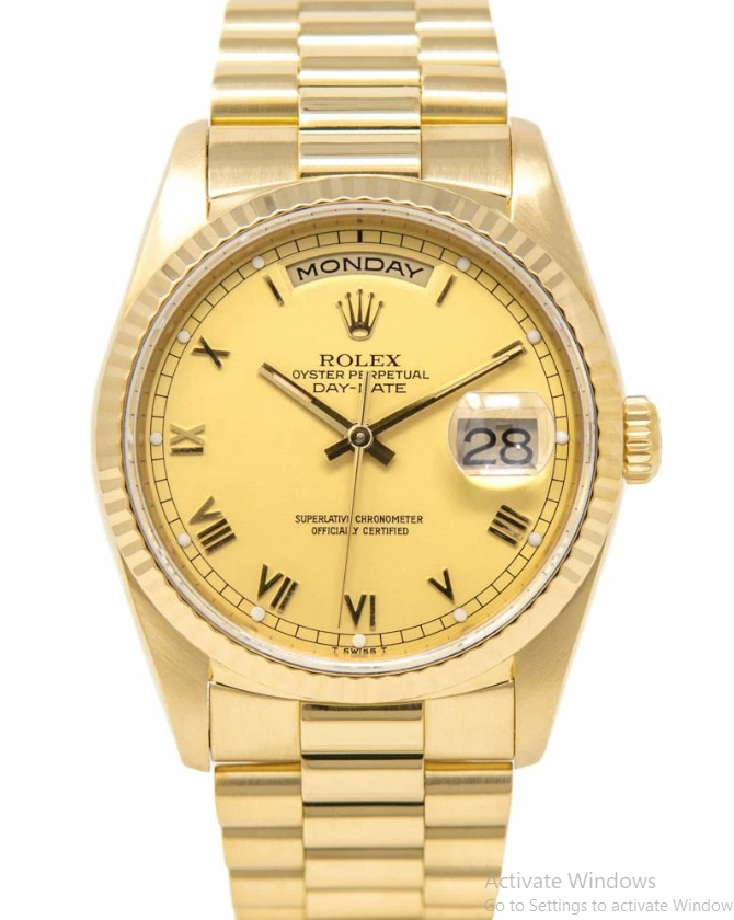 Day-Date 36mm in Yellow Gold with Fluted Bezel on President Bracelet with Champagne Roman Dial