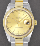 Datejust 36mm in Steel with Yellow Gold Smooth Bezel on Oyster Bracelet with Champagne Index Dial