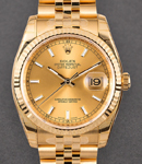 Datejust 36mm in Yellow Gold with Fluted Bezel on Jubilee Bracelet with Champagne Stick Dial