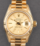 President in Yellow Gold with Fluted Bezel on Yellow Gold President Bracelet with Champagne Tapestry Stick Dial