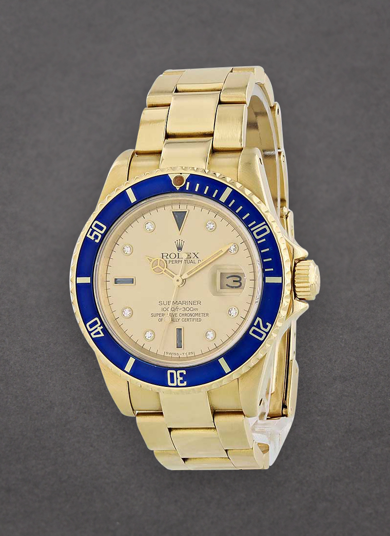 Pre-Owned Rolex Submariner 40mm in Yellow Gold with Blue Bezel