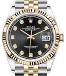 Datejust 36mm in Steel with Yellow Gold Fluted Bezel on Jubilee Bracelet with Black Diamond Dial