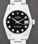 Lady's 26mm Datejust in Steel with White Gold Fluted Bezel on Oyster Bracelet with Black Diamond Dial