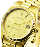 Midsize President  31mm in Yellow Gold with Fluted Bezel on President Bracelet with Champagne Stick Dial