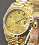 President in Yellow Gold with Fluted Bezel on President Bracelet with Champagne Diamond Dial