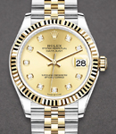 Midsize Datejust 31mm in Steel with Yellow Gold Fluted Bezel on Jubilee Braclet with Champagne Diamond Dial